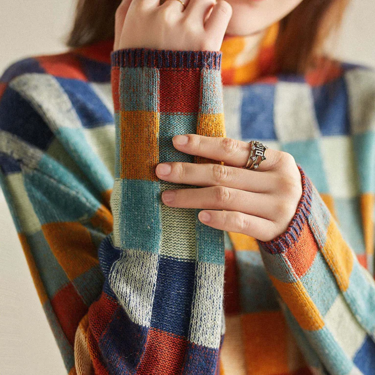 Women's multicolor checkered turtleneck sweater with long sleeves