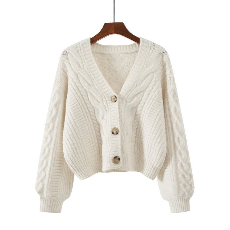 Women's cropped cable knit cardigan with V-neck and button front