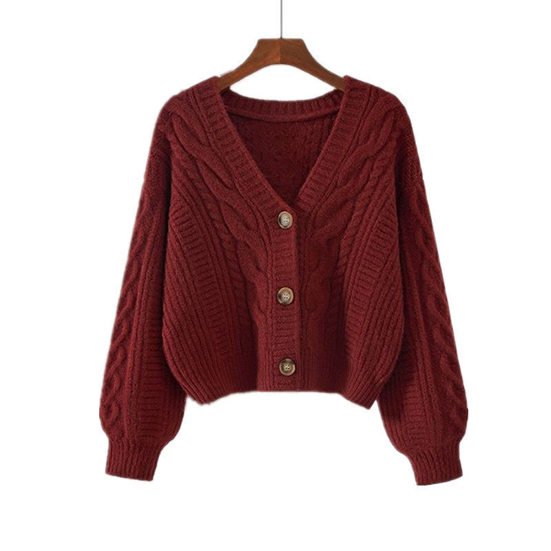 Women's cropped cable knit cardigan with V-neck and button front