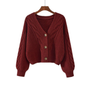 Women's cropped cable knit cardigan with V-neck and button front