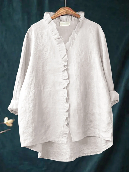 Long-sleeve ruffled V-neck blouse with button front and curved hem