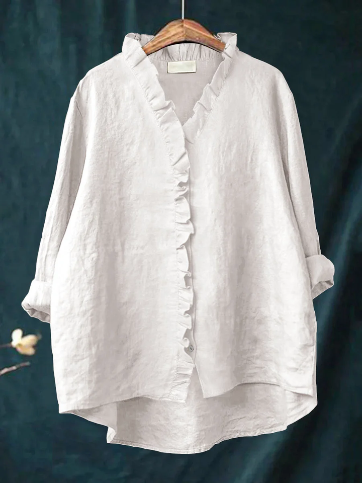 Long-sleeve ruffled V-neck blouse with button front and curved hem
