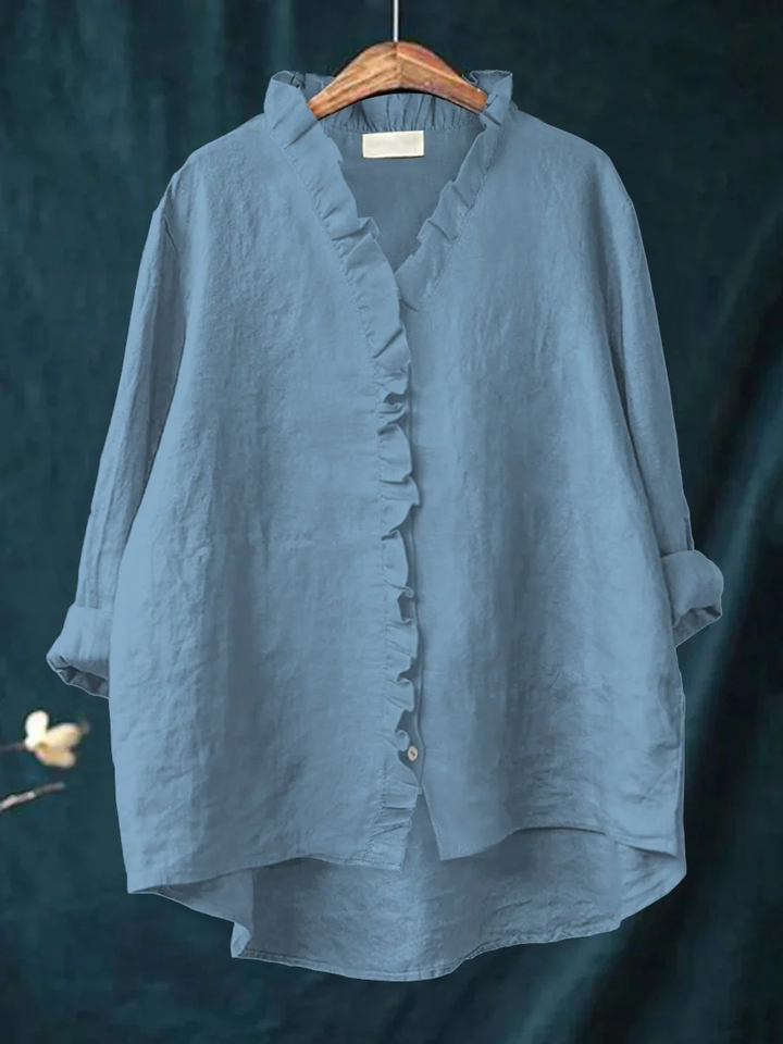 Long-sleeve ruffled V-neck blouse with button front and curved hem