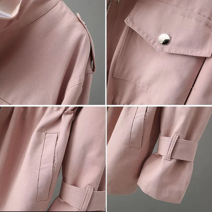 Women's hip-length rain coat with stand collar, utility pockets and adjustable cuffs