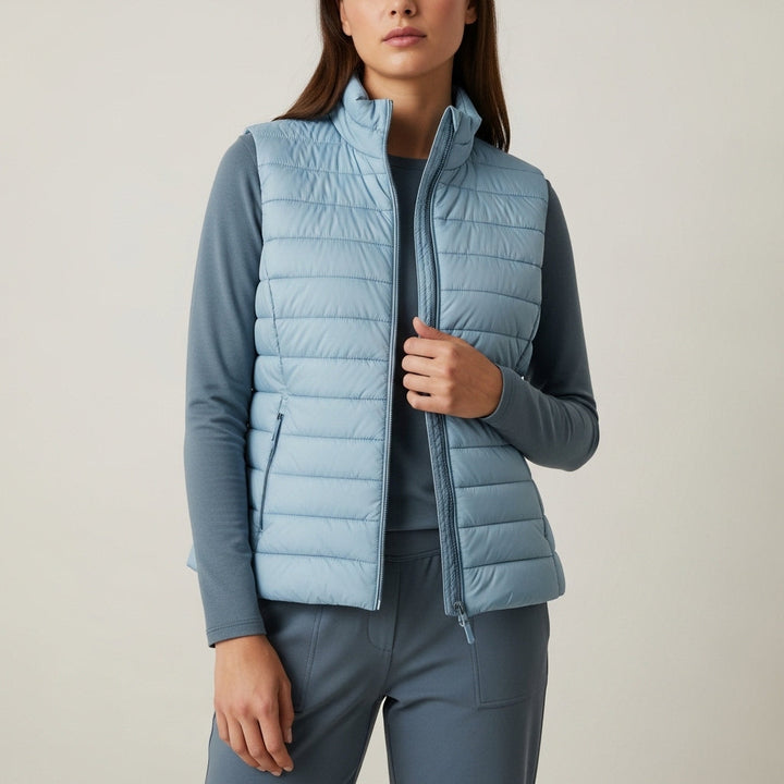 Women's sleeveless quilted vest with stand collar and front zip fastening