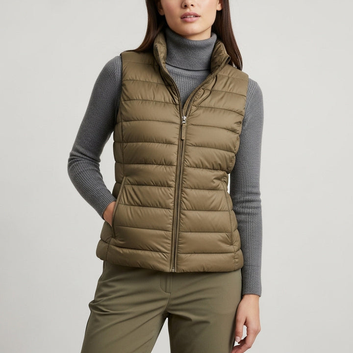 Women's sleeveless quilted vest with stand collar and front zip fastening