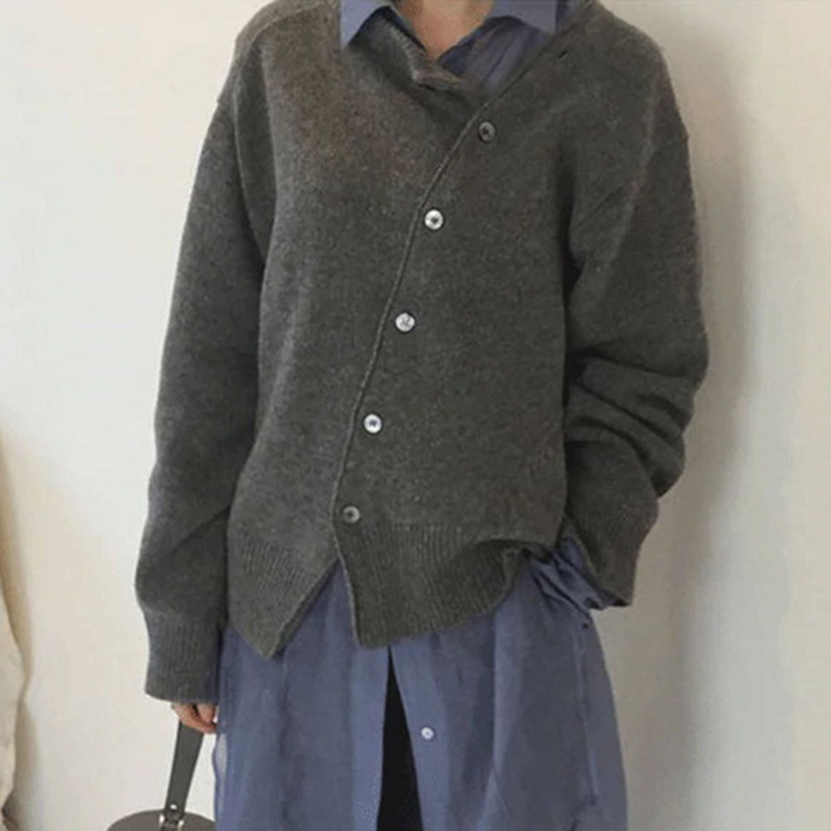 Women's button front cardigan sweater with long sleeves and ribbed trims