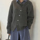 Women's button front cardigan sweater with long sleeves and ribbed trims