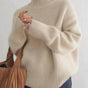 Women's long-sleeve turtleneck sweater with ribbed cuffs and hem
