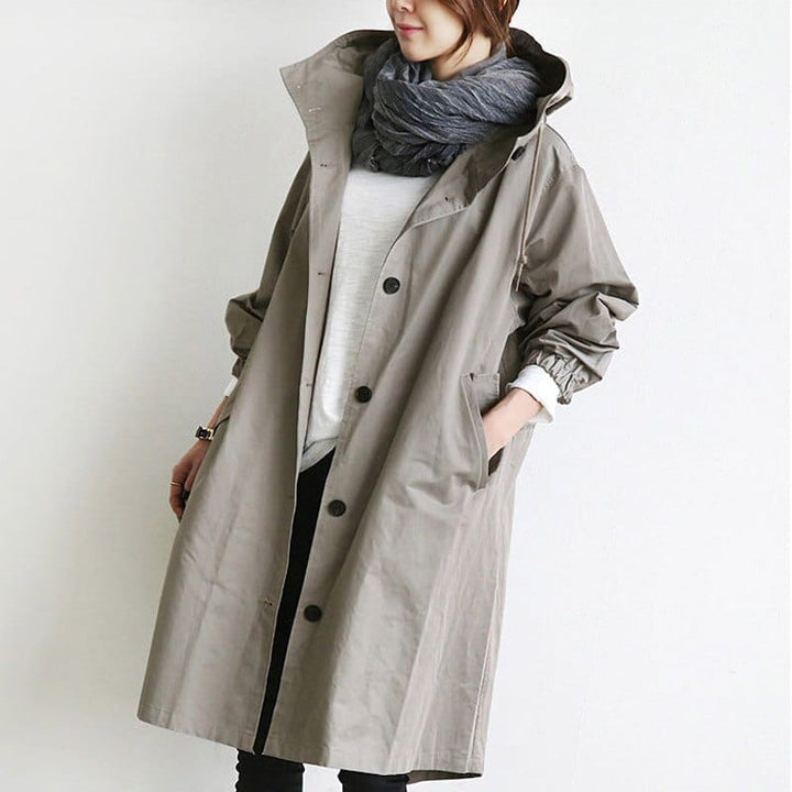Women's long hooded raincoat with button front and patch pockets