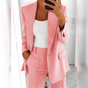 Women's tailored blazer and straight-leg trouser suit set with lapels and flap pockets