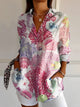 Women's patterned button-up shirt with collar and long sleeves