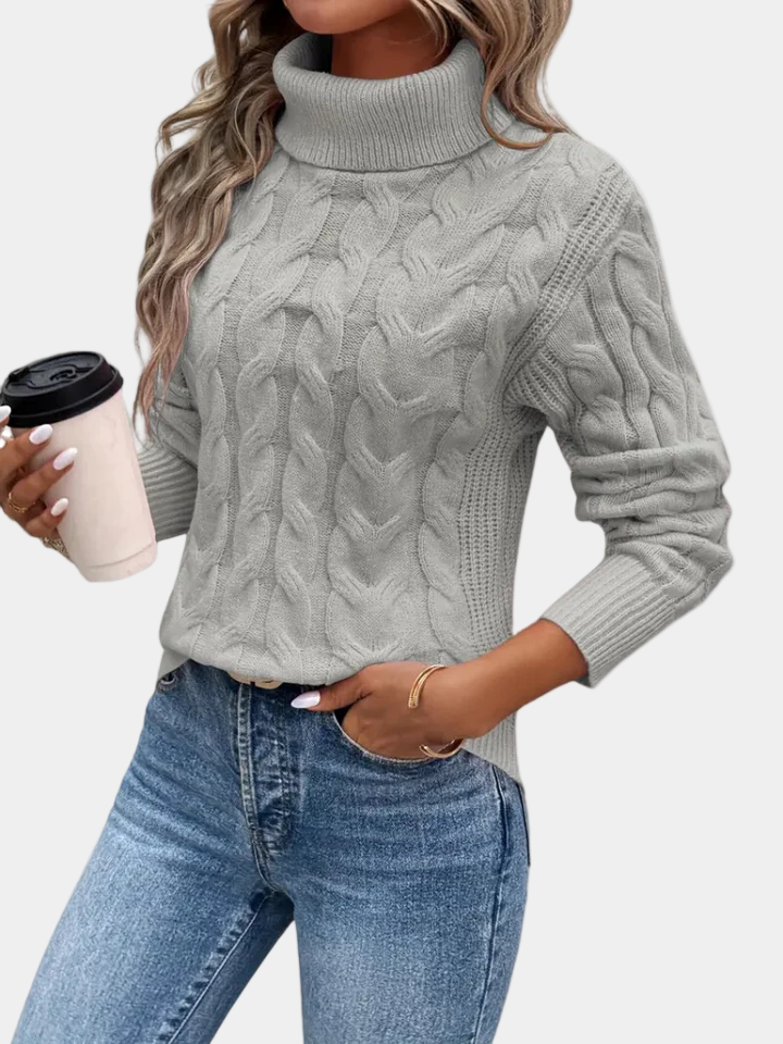 Women's cable knit turtleneck sweater with long sleeves