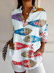 Women's patterned button-up shirt with collar and long sleeves
