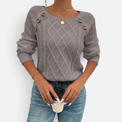 Women's cable knit sweater with shoulder buttons