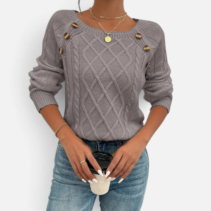 Women's cable knit sweater with shoulder buttons