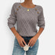 Women's cable knit sweater with shoulder buttons