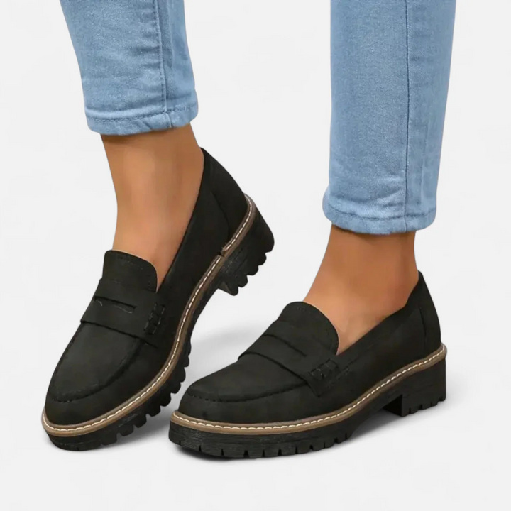 Women's penny loafers with chunky lug soles and stitched apron toes