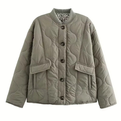 Women's quilted jacket with leopard-print cuffs, stand collar and patch pockets