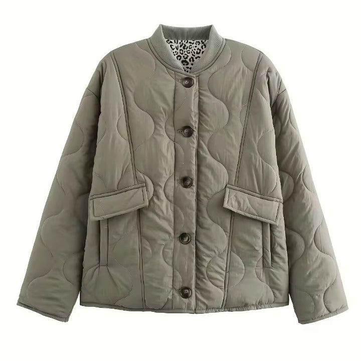 Women's quilted jacket with leopard-print cuffs, stand collar and patch pockets