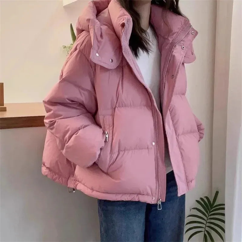 Women's hooded quilted puffer jacket with high neck, long sleeves and zip front