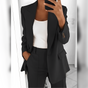 Women's tailored blazer and straight-leg trouser suit set with lapels and flap pockets
