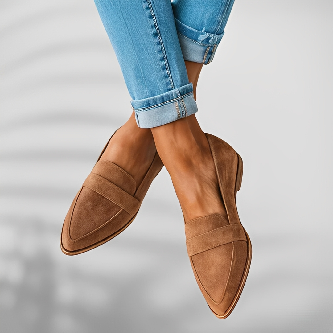 Women's pointed-toe penny loafers with low heels and vamp straps