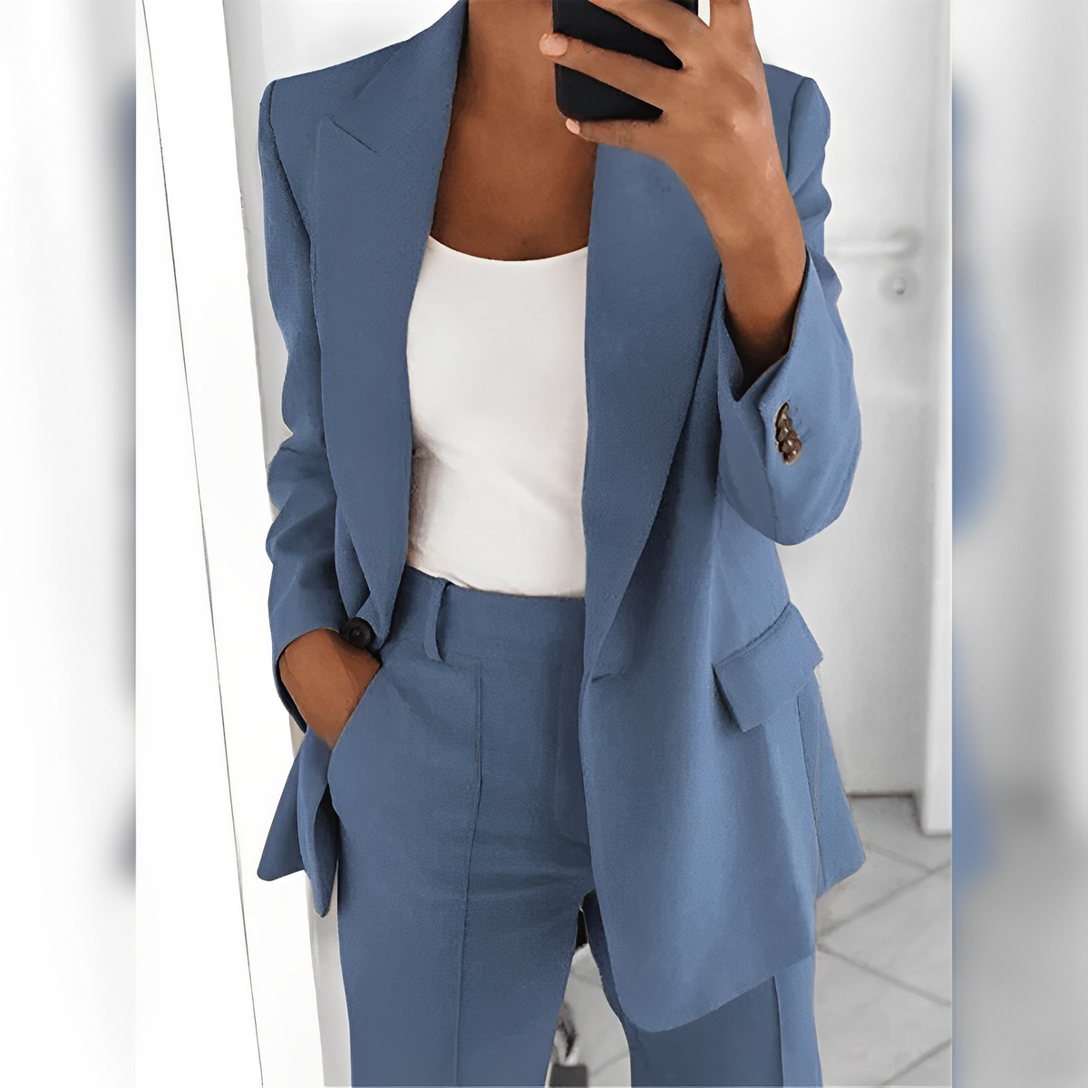 Women's tailored blazer and straight-leg trouser suit set with lapels and flap pockets