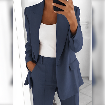 Women's tailored blazer and straight-leg trouser suit set with lapels and flap pockets