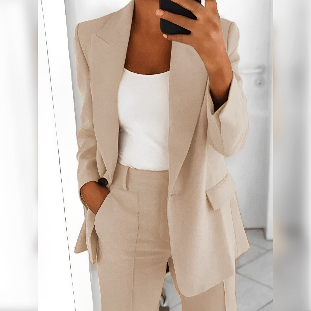 Women's tailored blazer and straight-leg trouser suit set with lapels and flap pockets