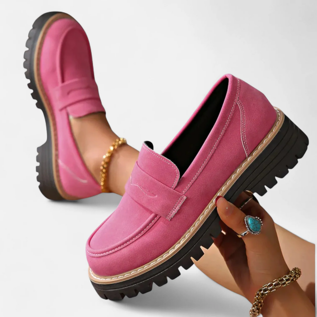 Women's penny loafers with chunky lug soles and stitched apron toes