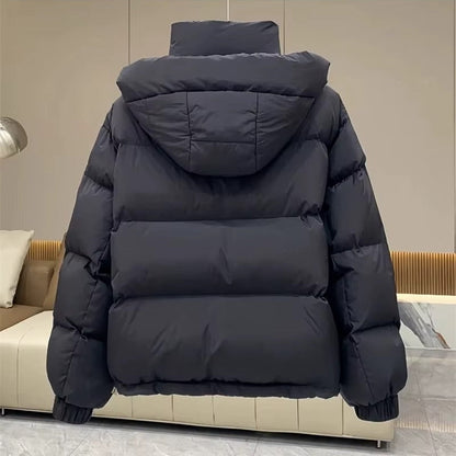 Women's hooded quilted puffer jacket with high neck, long sleeves and zip front