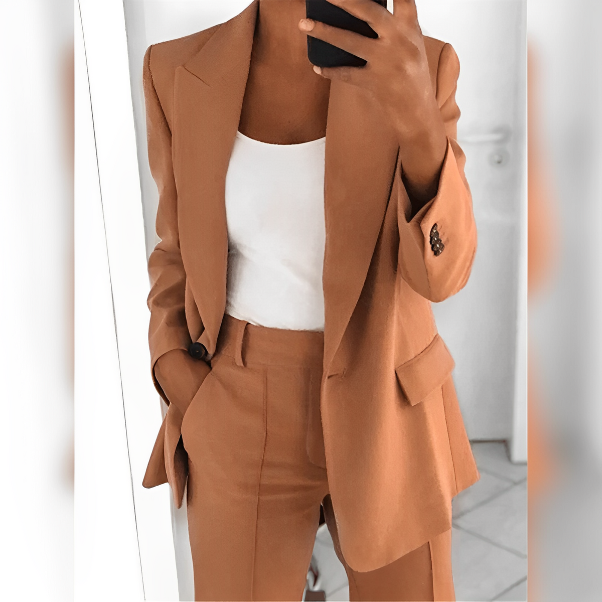 Women's tailored blazer and straight-leg trouser suit set with lapels and flap pockets
