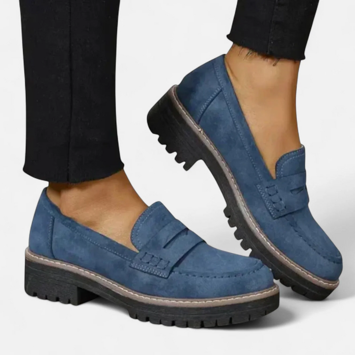Women's penny loafers with chunky lug soles and stitched apron toes