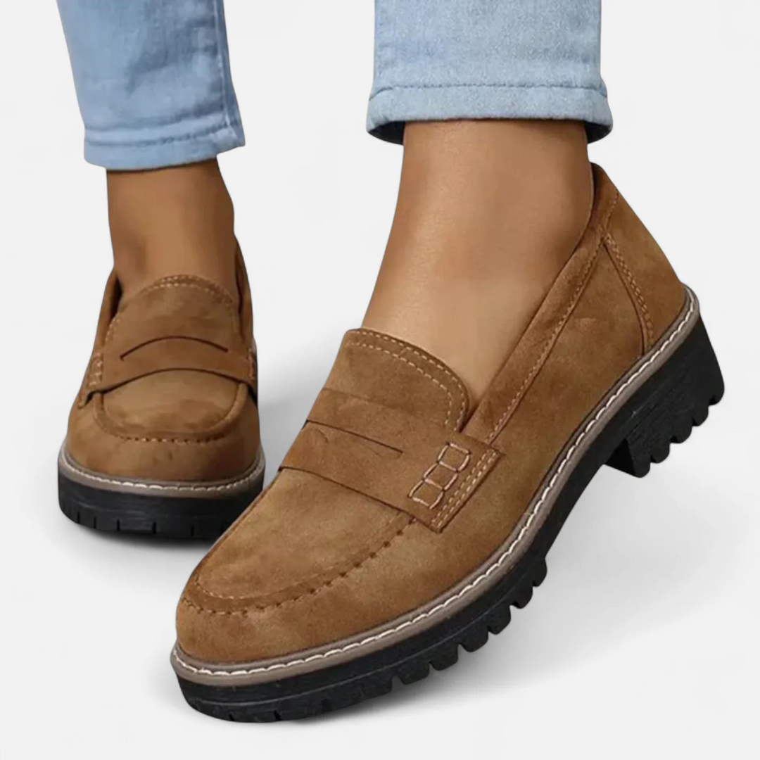 Women's penny loafers with chunky lug soles and stitched apron toes
