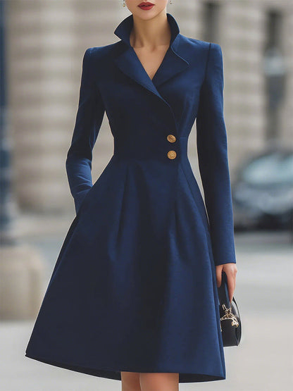 Women's navy tailored midi dress with peak lapels, long sleeves and flared skirt