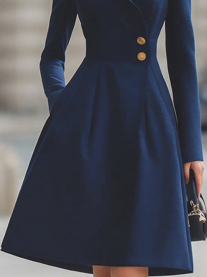 Women's navy tailored midi dress with peak lapels, long sleeves and flared skirt