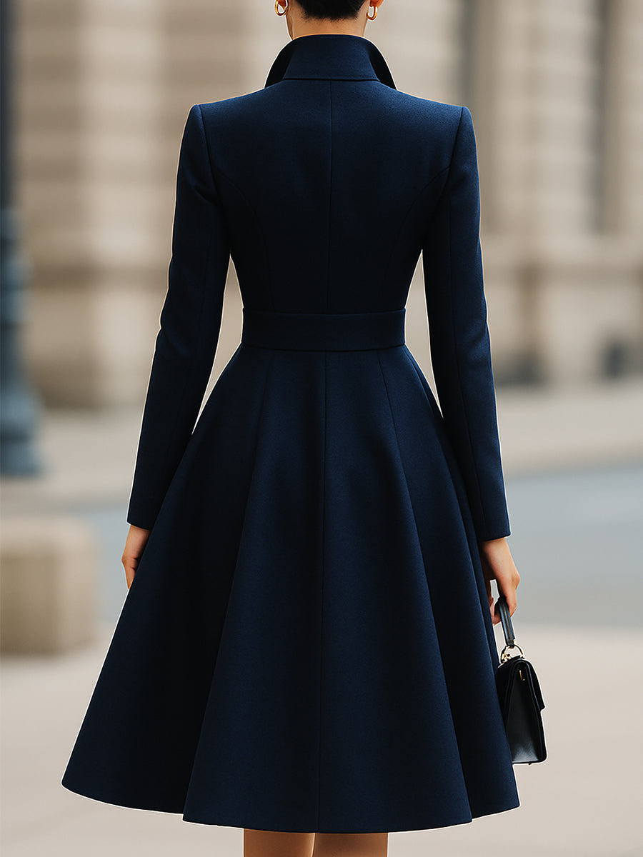 Women's navy tailored midi dress with peak lapels, long sleeves and flared skirt