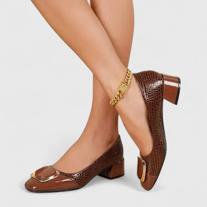 Women's pointed-toe embossed loafer pumps with block heels and decorative buckle details