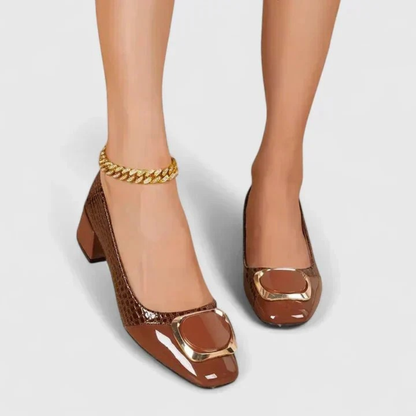 Women's pointed-toe embossed loafer pumps with block heels and decorative buckle details