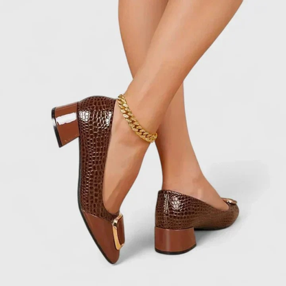Women's pointed-toe embossed loafer pumps with block heels and decorative buckle details