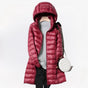 Women's hooded quilted longline puffer jacket with zip front