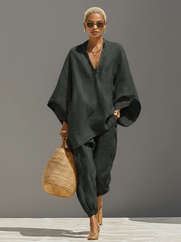 Women's textured beige asymmetric two-piece set with oversized shirt and tapered trousers