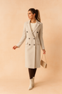 Women's double-breasted long coat with lapels and flap pockets