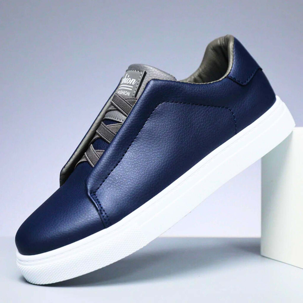 Low-top lace-up sneaker with panelled upper and contrast rubber sole