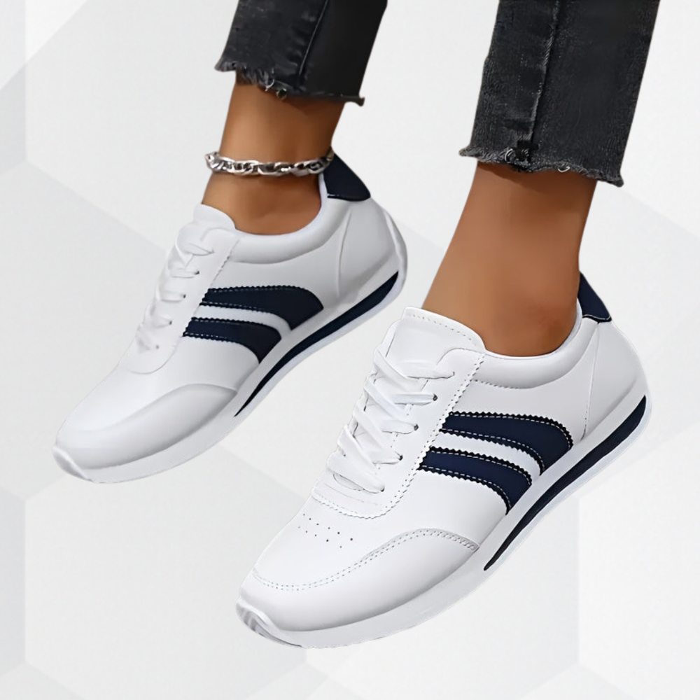 White lace-up sneakers with navy side stripes and flat soles