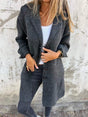 Women's lapel collar button-front coat with long sleeves and front pockets