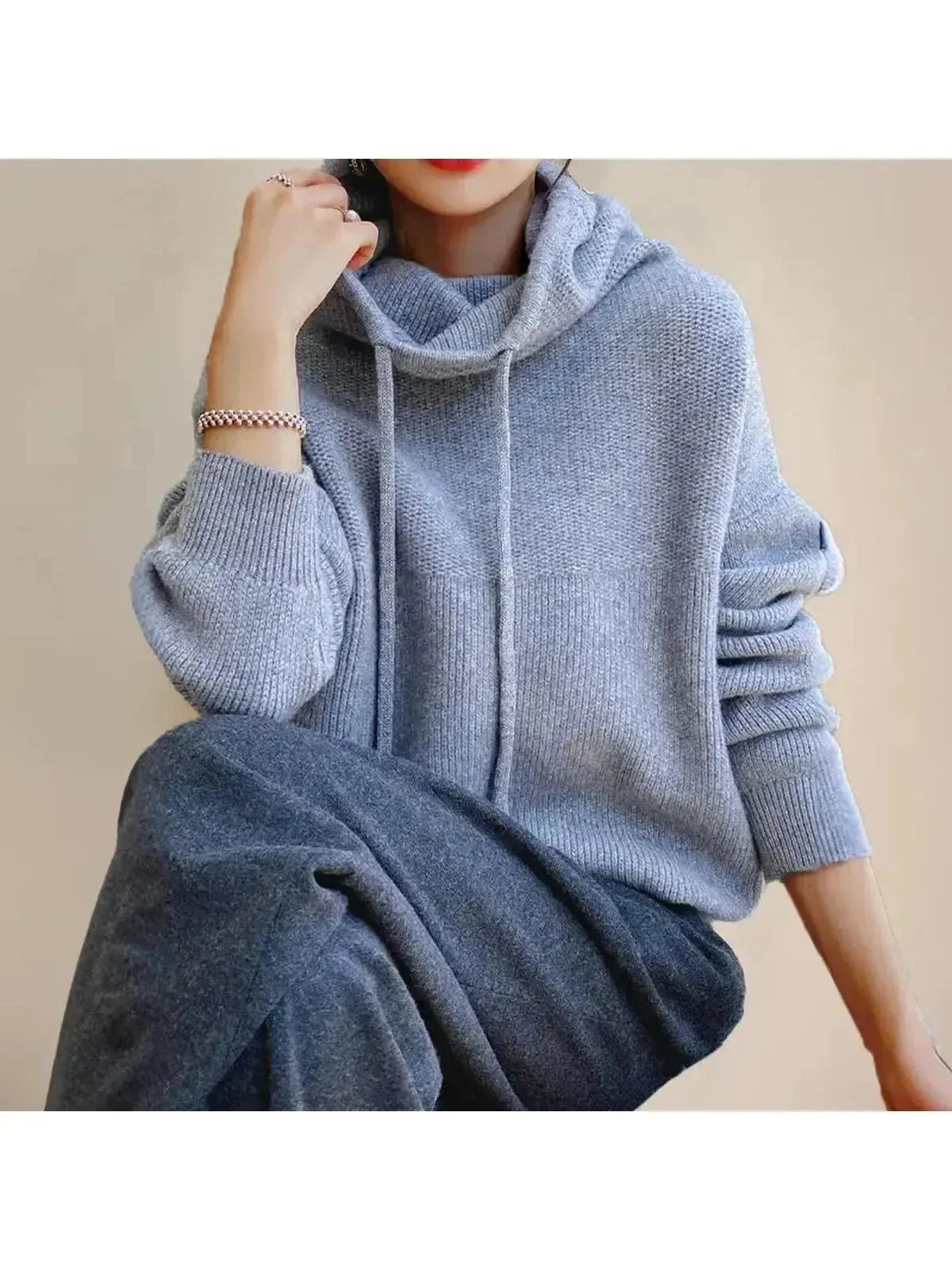 Women's hooded knit sweater with drawstrings and ribbed trims