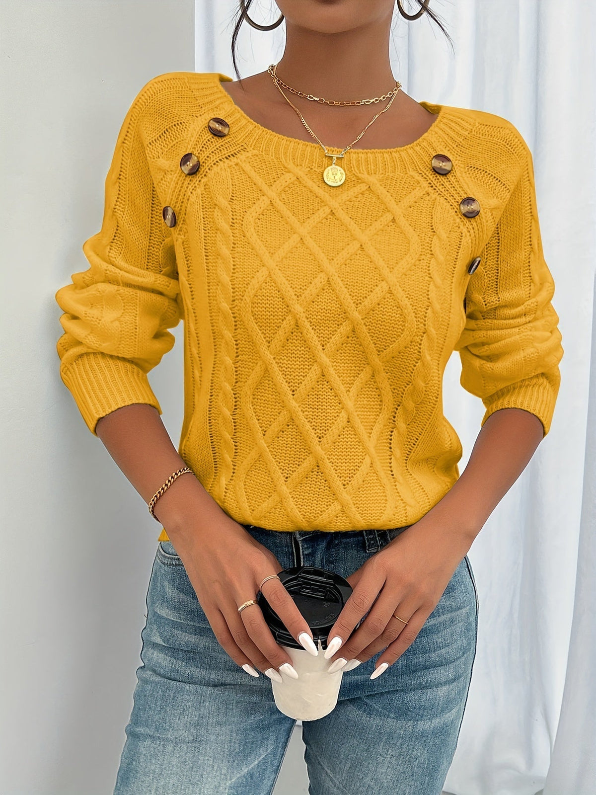 Women's textured knit sweater with diamond pattern, long sleeves and shoulder buttons
