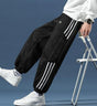 Men's tapered jogger pants with contrast side stripes and elastic cuffs